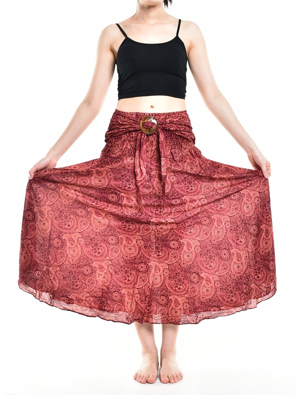 Bohotusk Red Orbit Long Skirt featuring a coconut buckle, showcasing its flowing design and elasticated smocked waist.